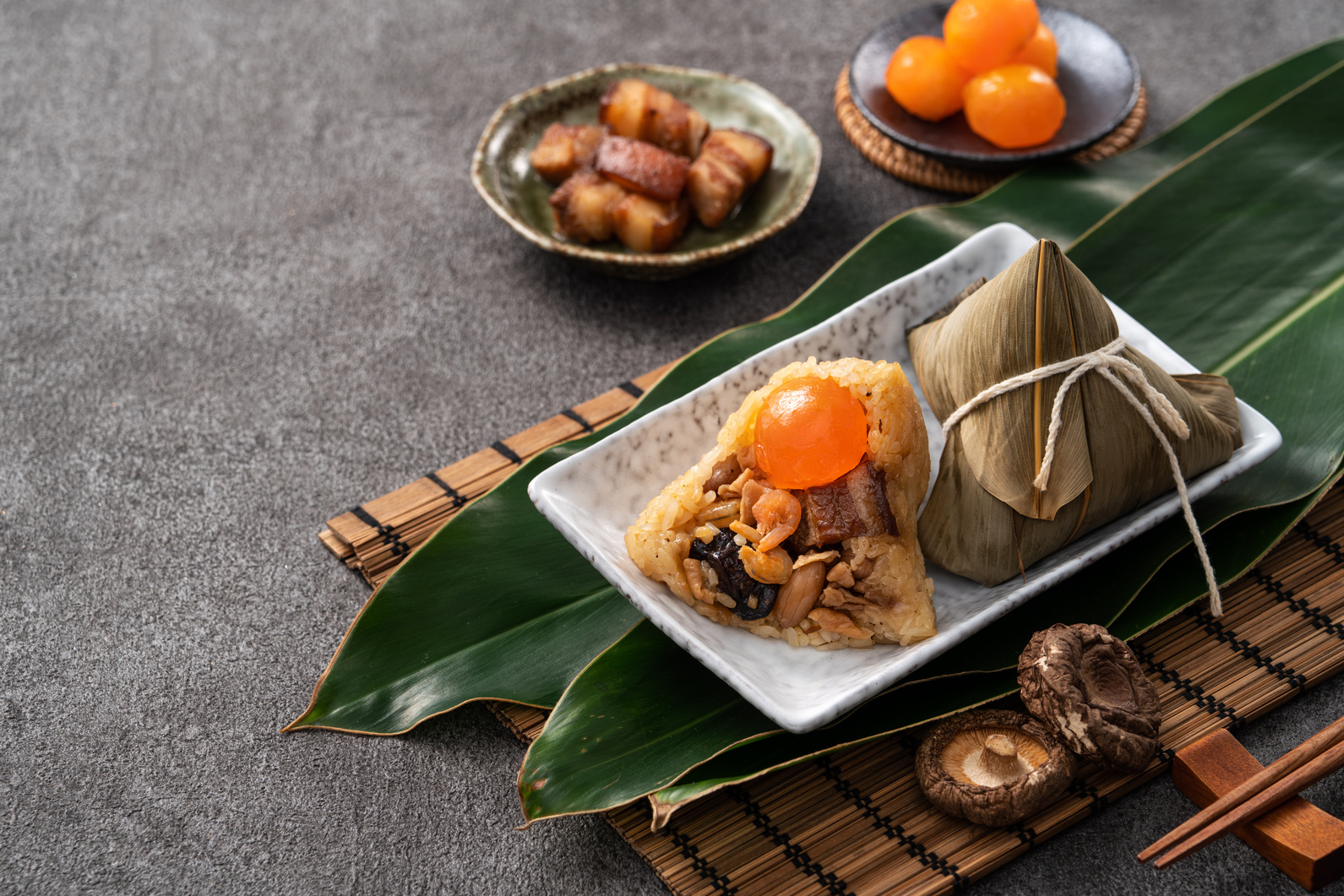 Zongzi, rice dumpling for Dragon Boat Festival on dark gray