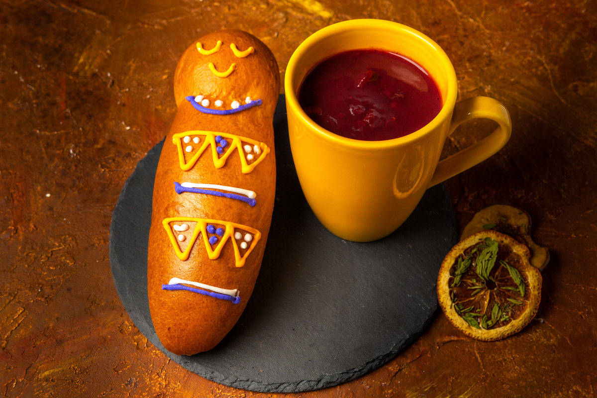 Guagua de pan and colada morada. Ecuadorian traditional food on the day of the deadGuagua de pan and colada morada. Ecuadorian traditional food on the day of the dead